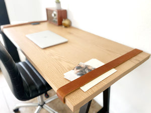 Wood desk top with cognac leather straps 