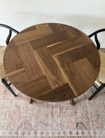 Load image into Gallery viewer, Modern Round Walnut Herringbone Dining Table with Tapered Walnut Wood Legs
