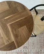 Load image into Gallery viewer, Modern Round Walnut Herringbone Dining Table with Tapered Solid Walnut Wood Legs
